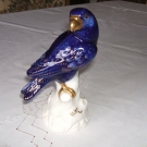 Porzellanfigur auf Ast " Papagei  " gemarkt