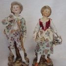 PAIR ANTIQUE 19th C DRESDEN PORCELAIN FIGURES IN FLORAL CLOTHES MAN WITH STAFF